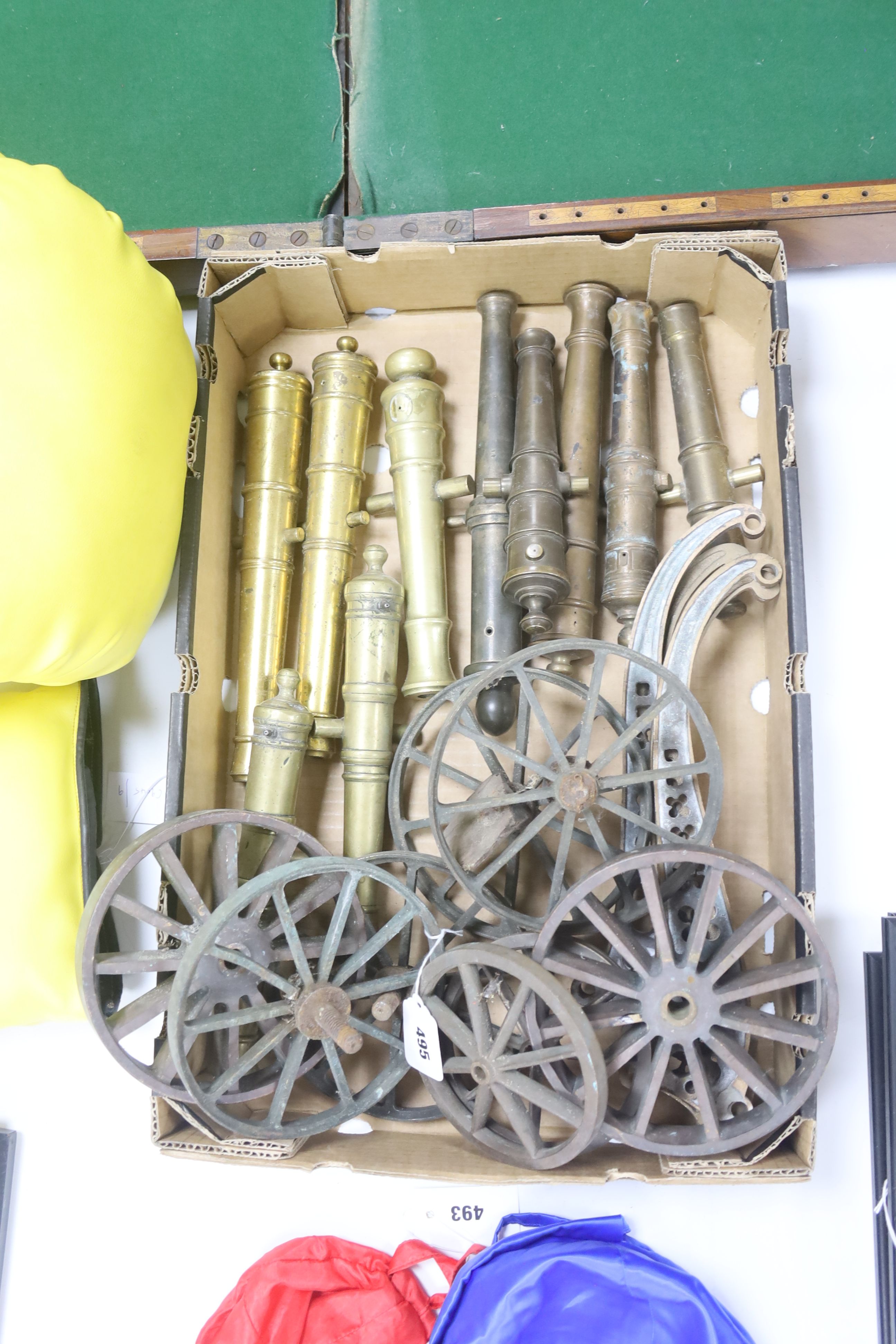 A quantity of cast bronze and brass model cannons, assorted carriage wheels and parts, 20th century, barrel lengths 23-31cm